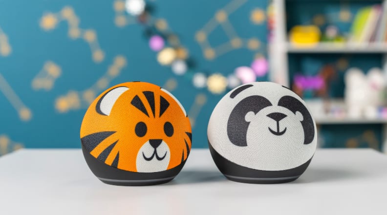 Two Kids Edition Echo Dots, one with a tiger design, one with a panda design.