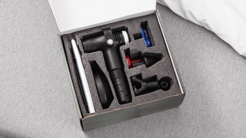 The box of the Prosage Thermo Copper Massage Gun with its various attachments