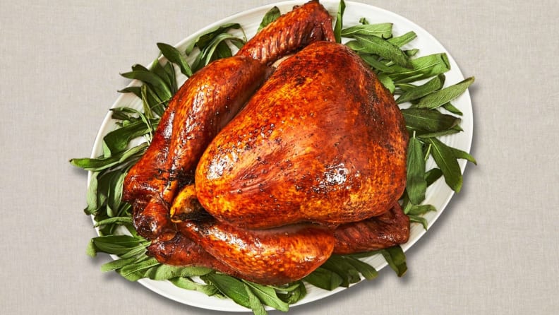 A Thanksgiving turkey on a bed of lettuce, shot from above.