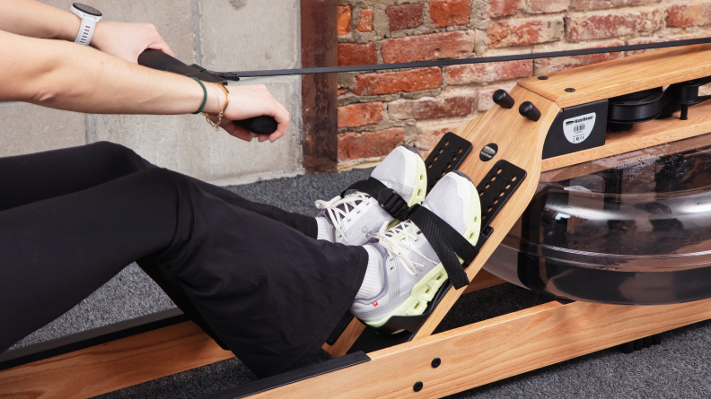 Shot of the water rower mechanism and feet strapped in.