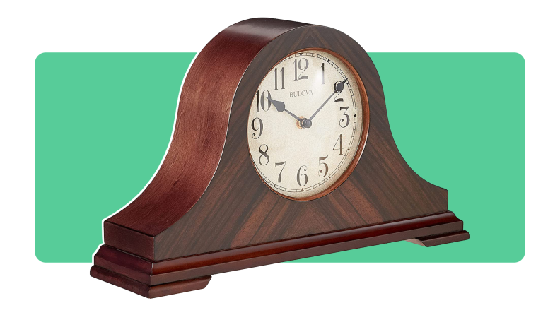 Product shot of the dark wooden clock from Bulova.