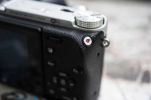 The Samsung NX500 has a dedicated record button that is easily reached with the right thumb.