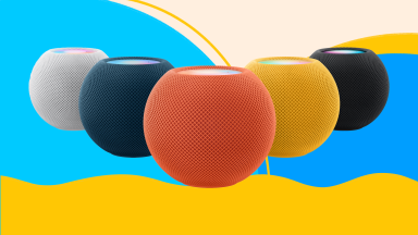 Apple HomePod minis in white, navy, peach, yellow, and black.