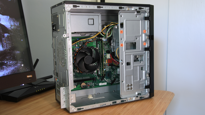 The interior of an Acer desktop tower showing the inner machinery.