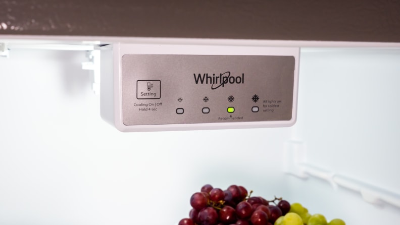 A close-up of the Whirlpool WRT518SZFM top-freezer fridge's temperature controls.