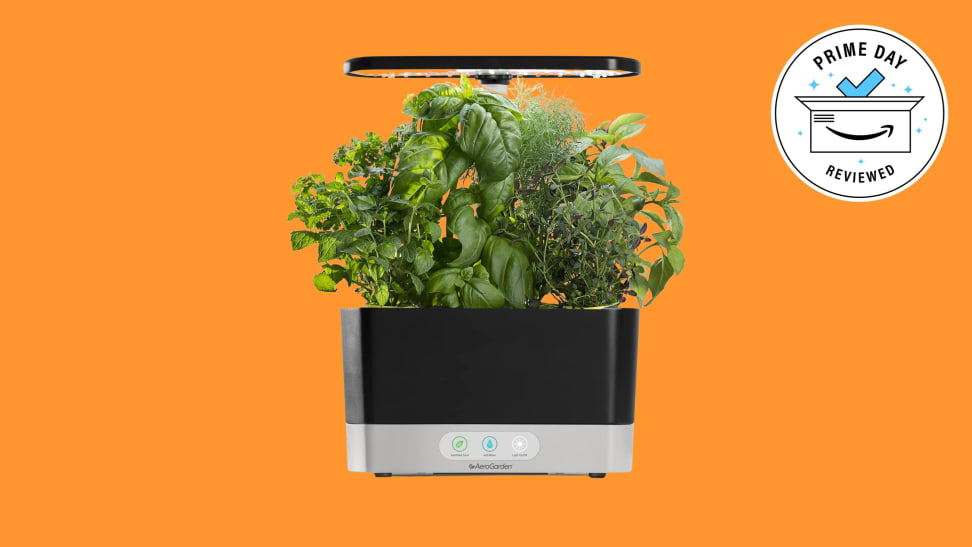 The AeroGarden Harvest silhouetted against an orange background.