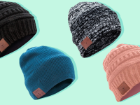 Four colorful beanies against a green background.