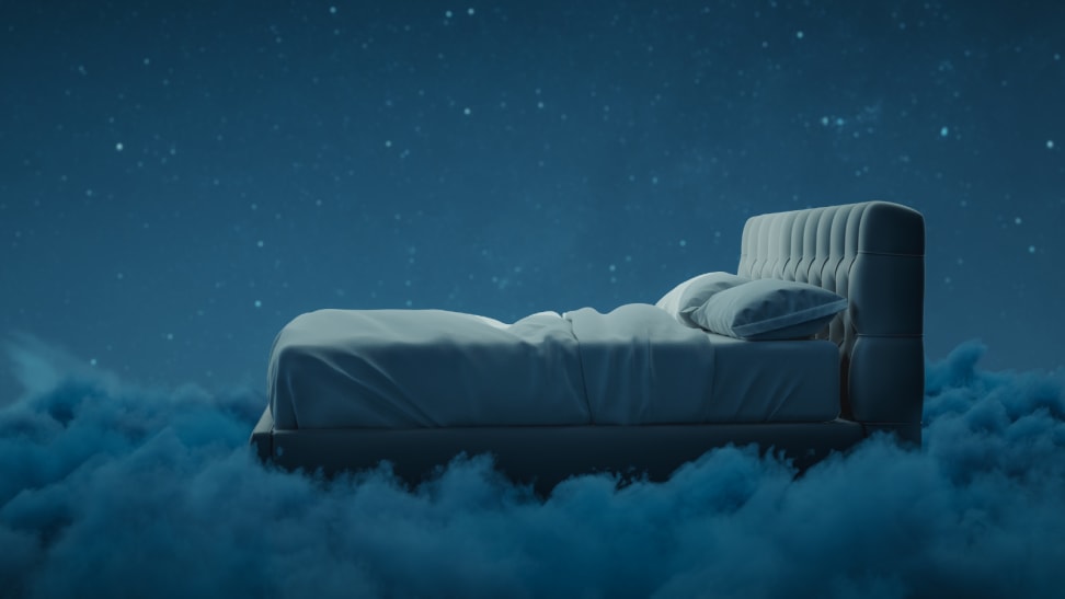 Bed sitting atop clouds during the nighttime