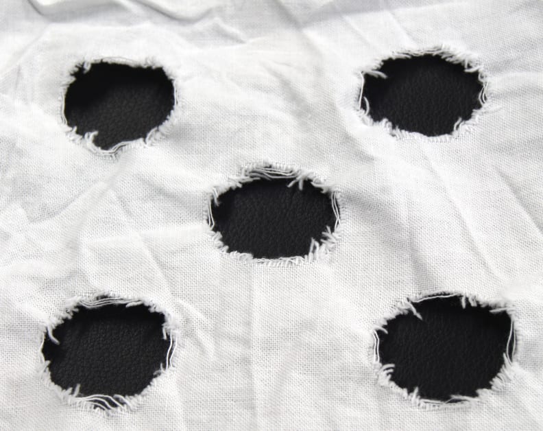 This is an example of a used mechanical action strip. The frayed strains with the circles are tallied up to determine the amount of clothes wear.