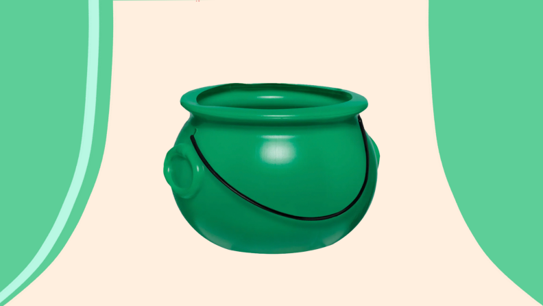 Plastic green bucket shaped as cauldron.