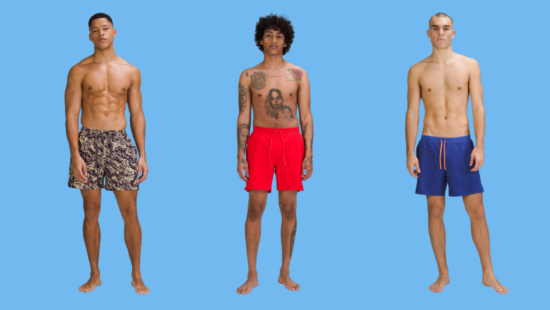 Three men's swimsuits: One in a gold print, one in bright red, and one in bright blue.