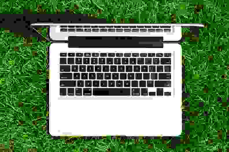 Laptop outside in grass