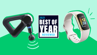 The Theragun massager and Fitbit Charge 5 on a graphic background for Reviewed's Best of Year