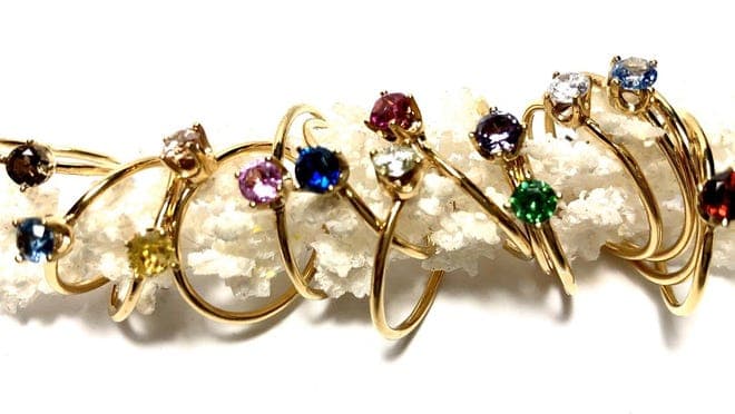Gold rings with colorful stones.