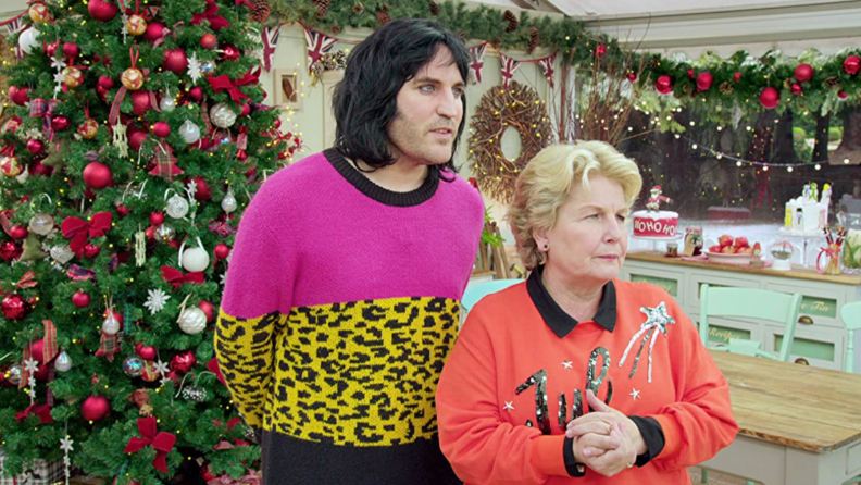 A still from The Great British Baking Show featuring Sandi Tolvig and Noel Fielding