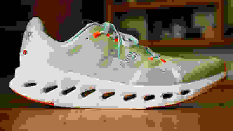 Profile view of the On Cloudsurfer sneakers in mint green.