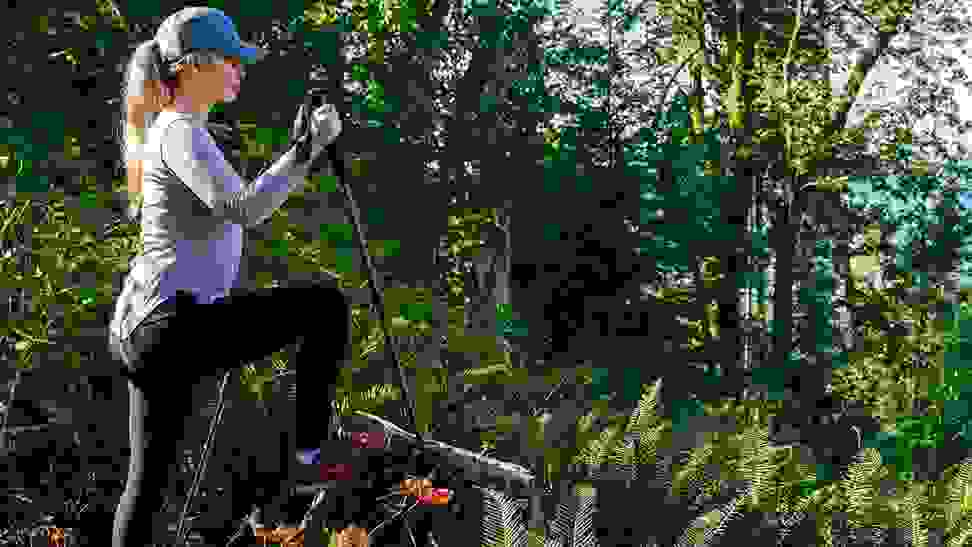 girl outside in a blue hat using BAFX Trekking Walking Hiking Poles