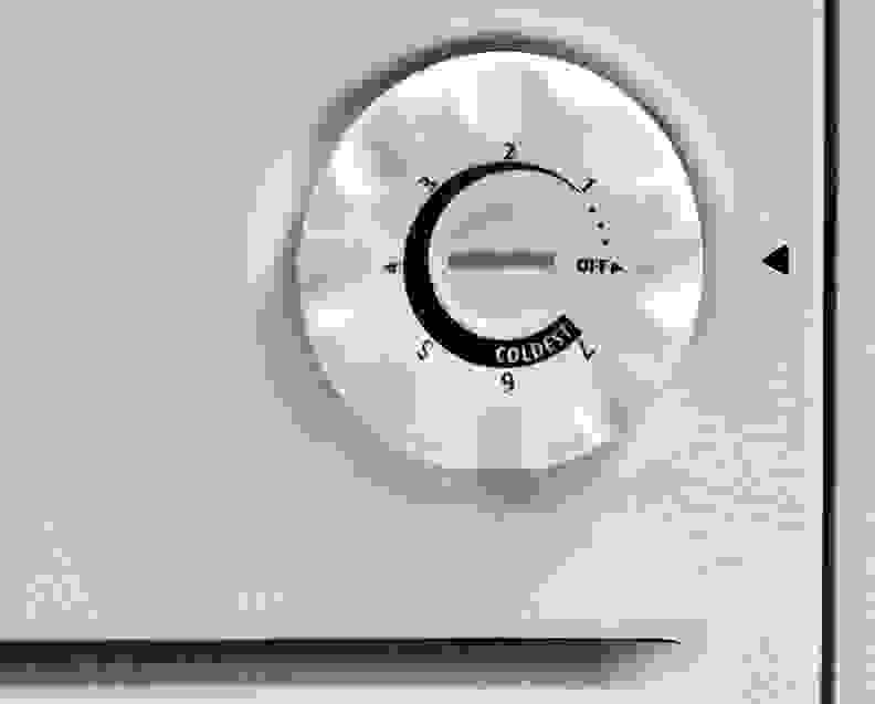 A basic knob thermostat controls internal temperatures inside the Frigidaire Gallery FGCH25M8LW.