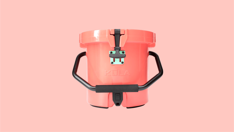 A pink cooler with a black handle and dispenser.