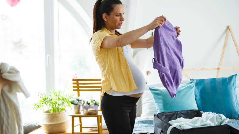 Pregnant woman packing hospital bag