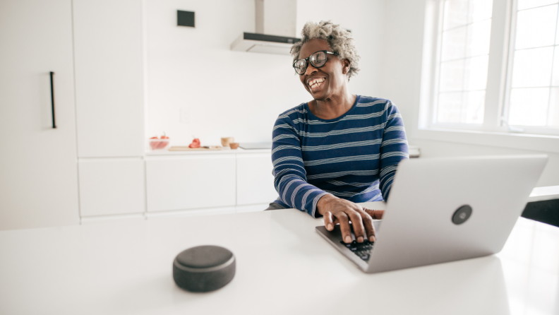 A person speaks to a smart speaker.