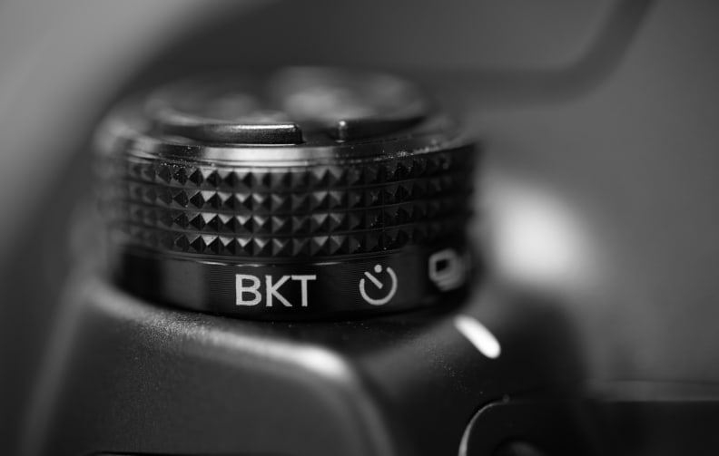 Like high-end Nikon DSLRs, the NX1 has a cluster of controls on the top plate of the camera, to the left of the EVF.