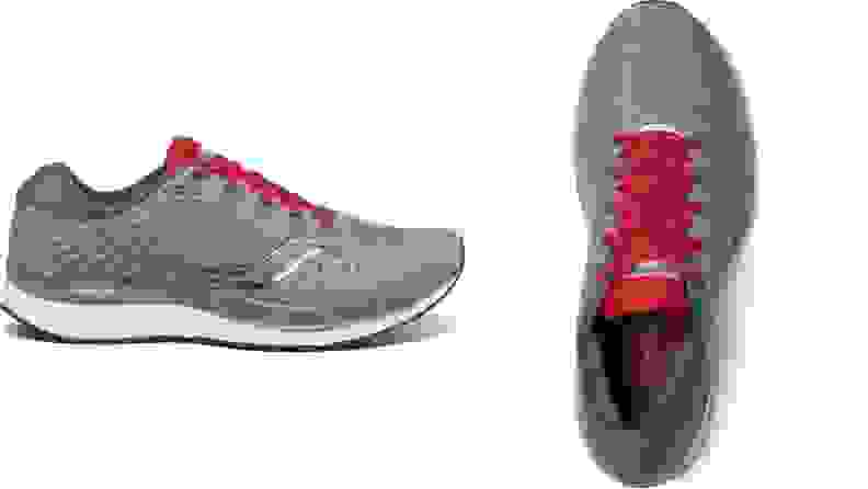 Pair of grey Saucony Guide 13 sneakers with red shoe laces and white soles.