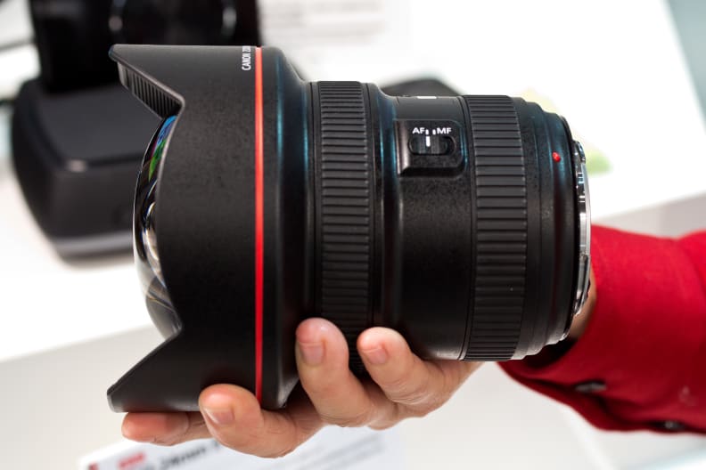 The 11-24mm f/4L is massive, easily dwarfing this poor woman's hand.