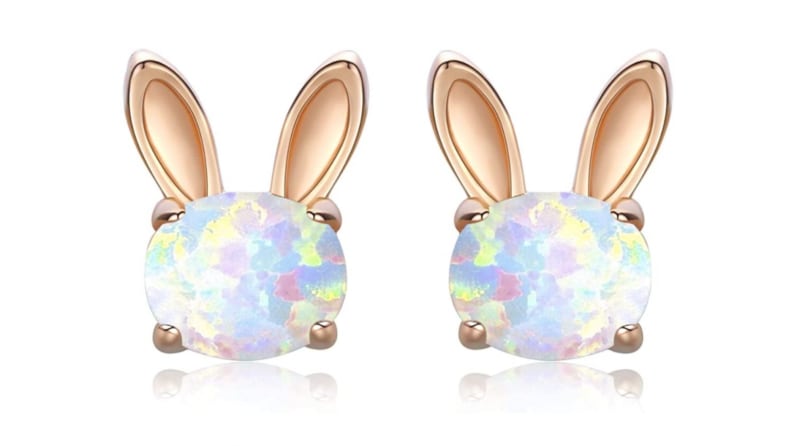 Gold bunny-shaped earrings with shimmering opal centers.