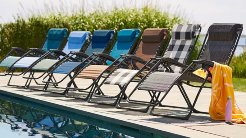 Multi-colored Kohl’s Sonoma Goods For Life regular antigravity chairs lined up on pool deck.