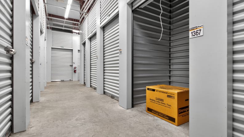 An empty storage facility with a cardboard box