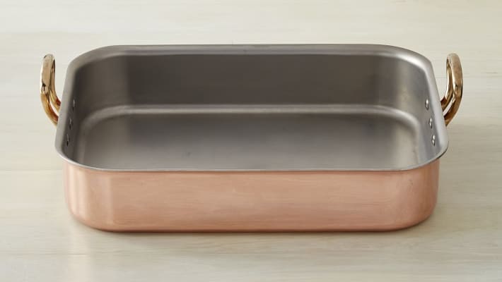 A copper roasting pan with handles.