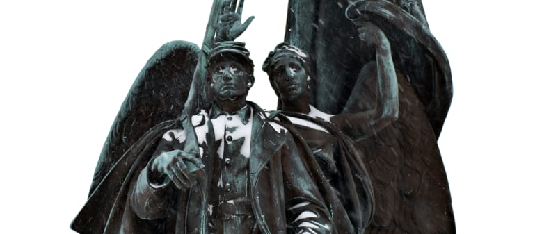 A photo of a statue taken during winter storm Juno.