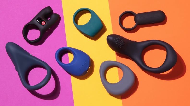 The We-Vibe Verge, Fun Factory Nōs, We-Vibe Pivot, Lelo Tor 2, Tenga SVR, Lovense Diamo and Maude Band on top of a a pink, yellow and orange surface.