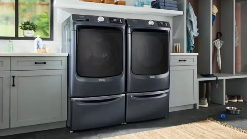 The Maytag MFW7020RF dryer in a laundry room next to its companion washer.