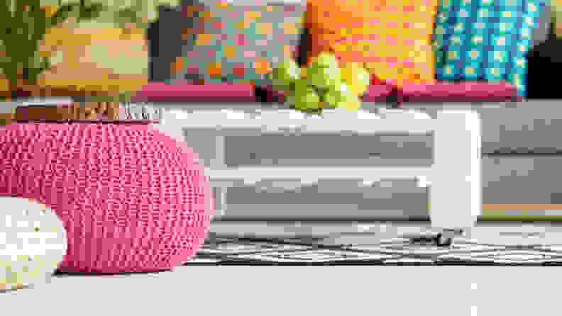 A bright pink pouf is cheerful, and doesn't take up much space