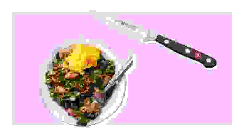 Dish of collard greens and Wusthof paring knife on purple background