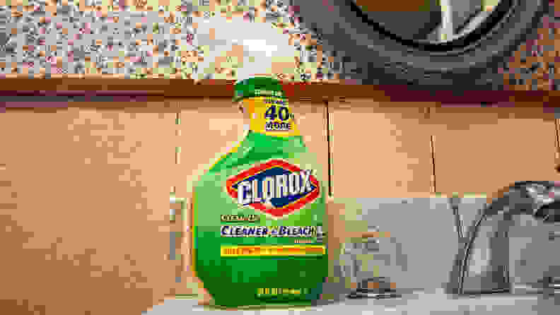 A spray bottle of Clorox Clean-Up and Bleach sits atop a bathroom sink.