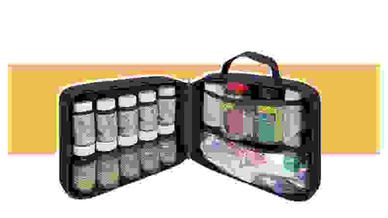 A StarPlus2 Padded Medicine Bag with a variety of pill bottles inside.