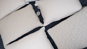 pillows spread out on a bed