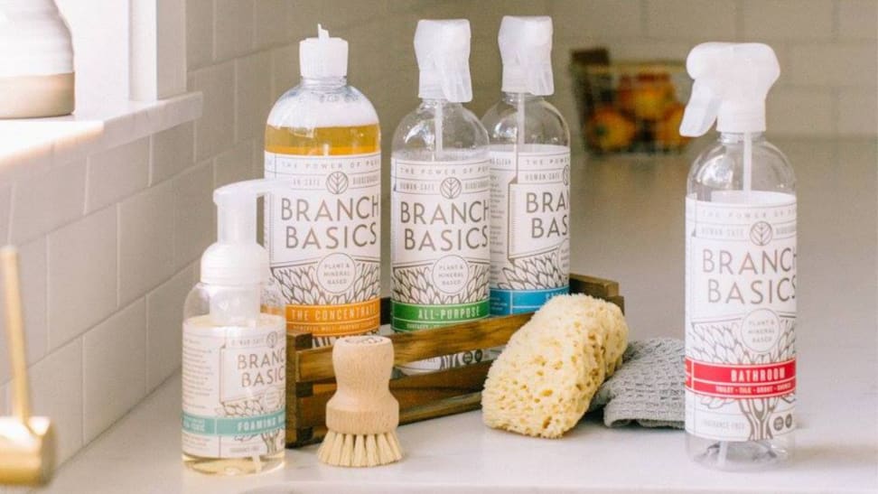 Branch Basics products lined up on counter, accompanied with a sponge and brush