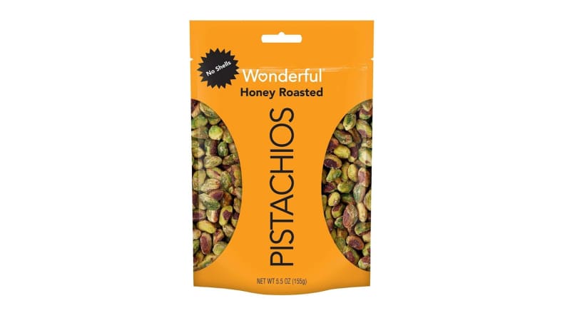 A yellow bag of honey roasted, no-shell pistachios.
