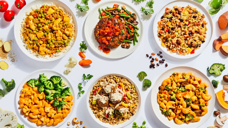 Six bowls full of Freshly Purely Plant meals