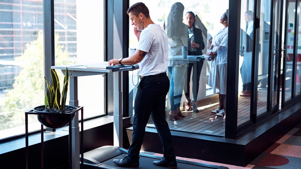 A man using an under-desk treadmill.