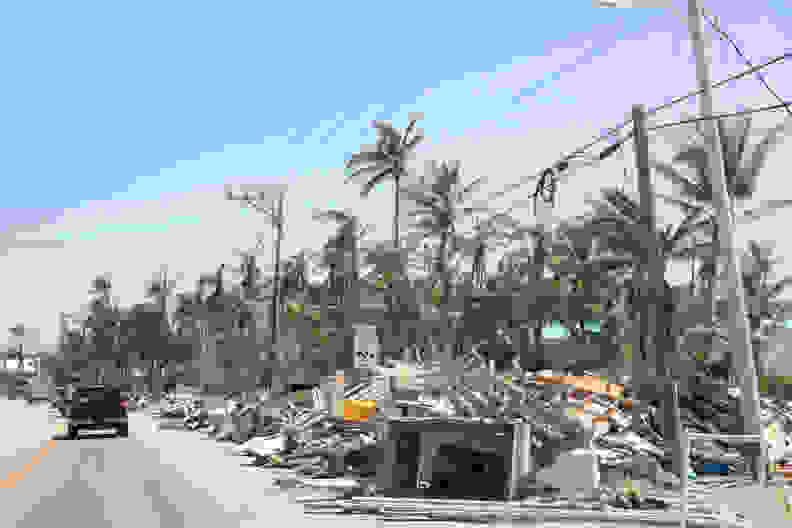 Trash and debris placed along the road post-hurricane.