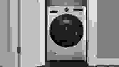 The LG WM6998HBA All-in-One washer-dryer combo in a modern apartment.