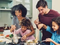 Family cooking dinner together
