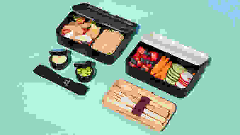 Fresh food like fruits and vegetables are stored in Bento boxes along with utensils.