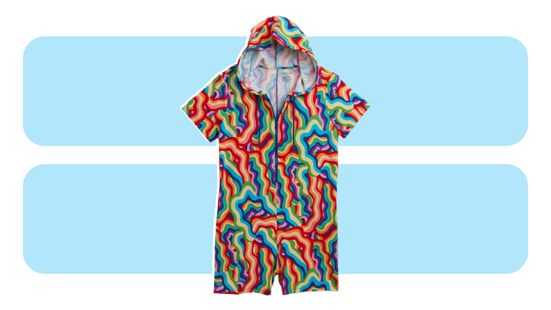 A romper printed with squiggly rainbow streaks.