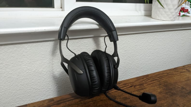 The HyperX Cloud III headphones up against a white window.